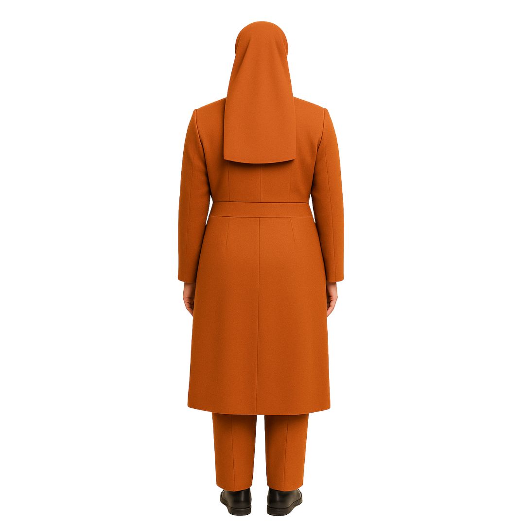 Person wearing an orange coat and pants on a white background