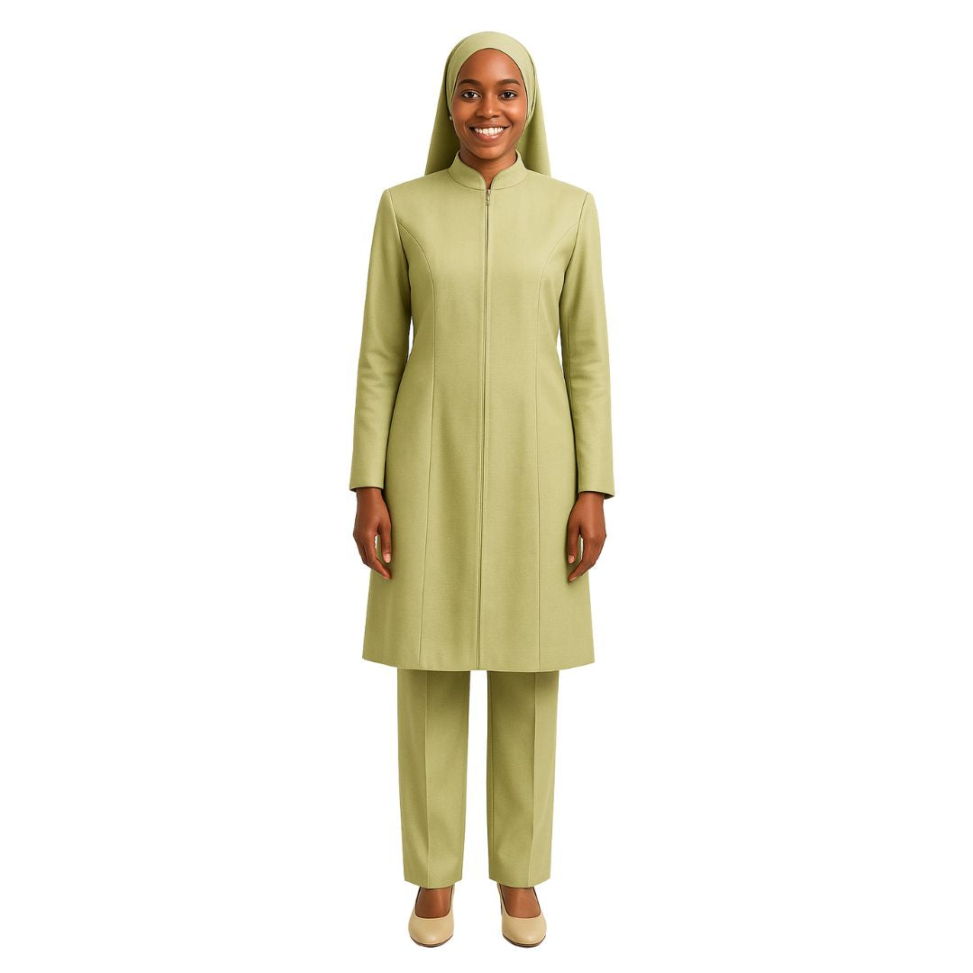 Woman wearing a green outfit with a matching hijab on a white background