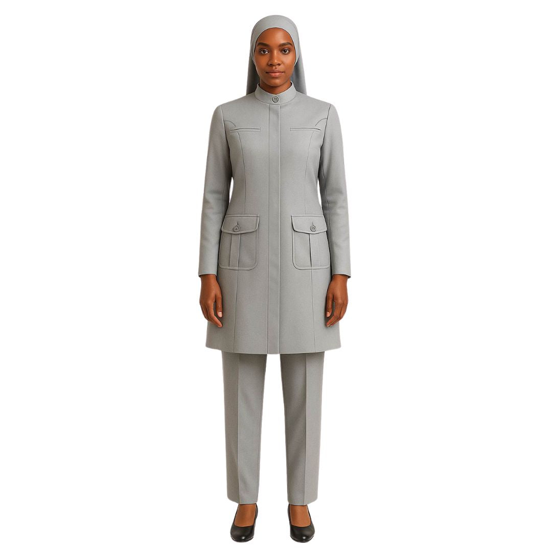 Woman wearing a gray suit with a matching headscarf on a white background