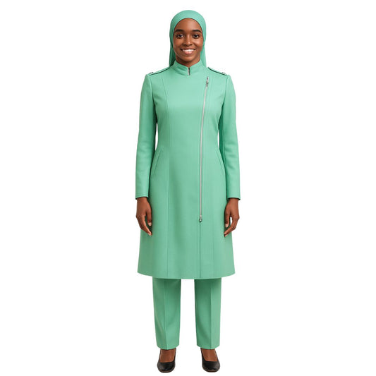 A woman wearing a green two-piece outfit with a long jacket and pants, featuring a full-length zipper in the front and shoulder buttons.