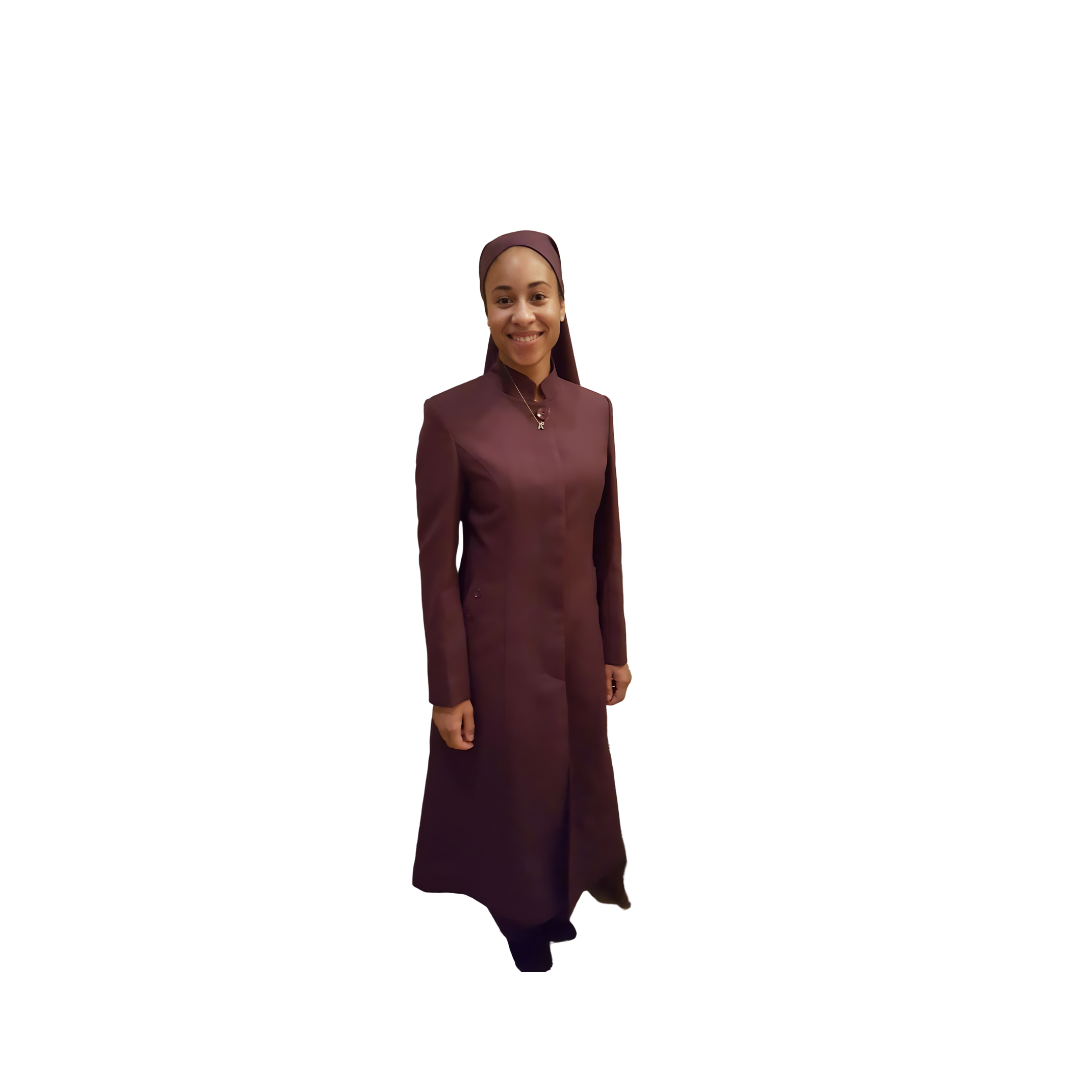 Full-body view of Cheryl modeling the Cheryl three-piece maroon garment from a tilted front and side angle, designed for Muslim sisters in the Nation of Islam who value women's modest clothing.