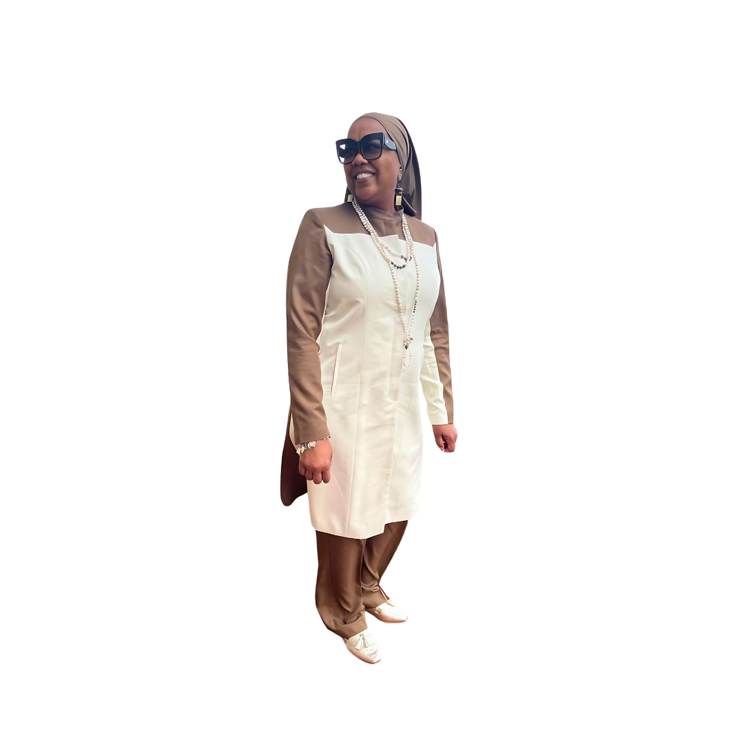 Full-body view of Maalikah modeling the Qiana three-piece brown and cream two tone garment from a tilted front and side angle, designed for Muslim sisters in the Nation of Islam who value women's modest clothing.