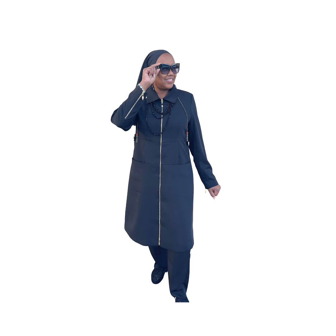 Full-body view of Maalikah modeling the Maalikah three-piece navy blue garment from a tilted front angle, designed for Muslim sisters in the Nation of Islam who value women's modest clothing.