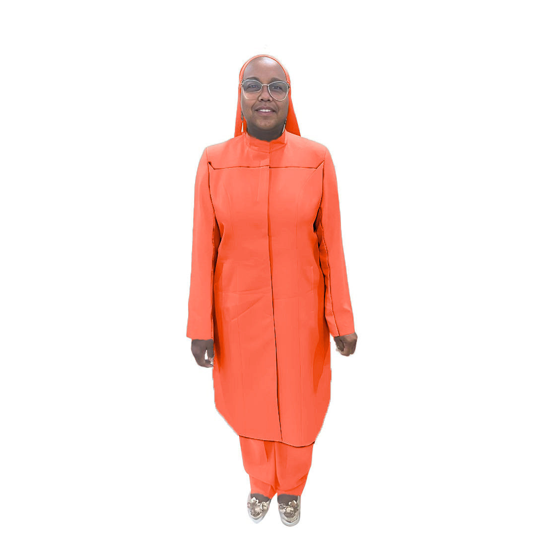 Full-body view of Maalikah modeling the Qiana three-piece coral blaze garment, designed for Muslim sisters in the Nation of Islam who value women's modest clothing.