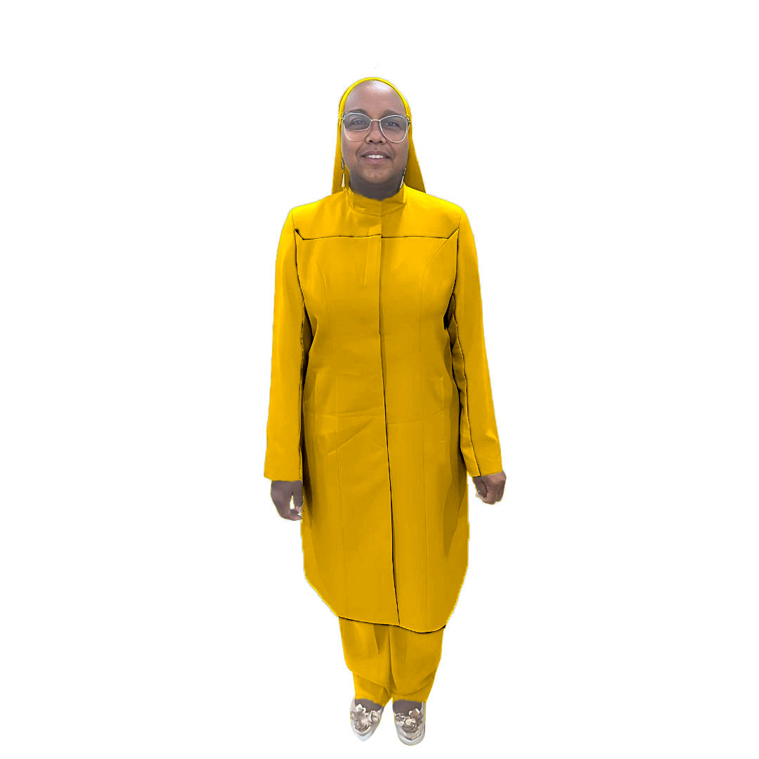 Full-body view of Maalikah modeling the Qiana three-piece golden glow garment, designed for Muslim sisters in the Nation of Islam who value women's modest clothing.