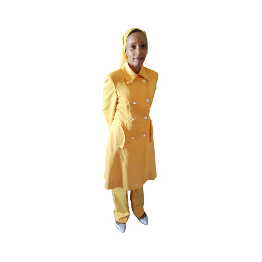 A woman wearing a yellow three-piece 'Warrior' garment from Kameelah's Closet, showcasing women's modest clothing inspired by the Nation of Islam.