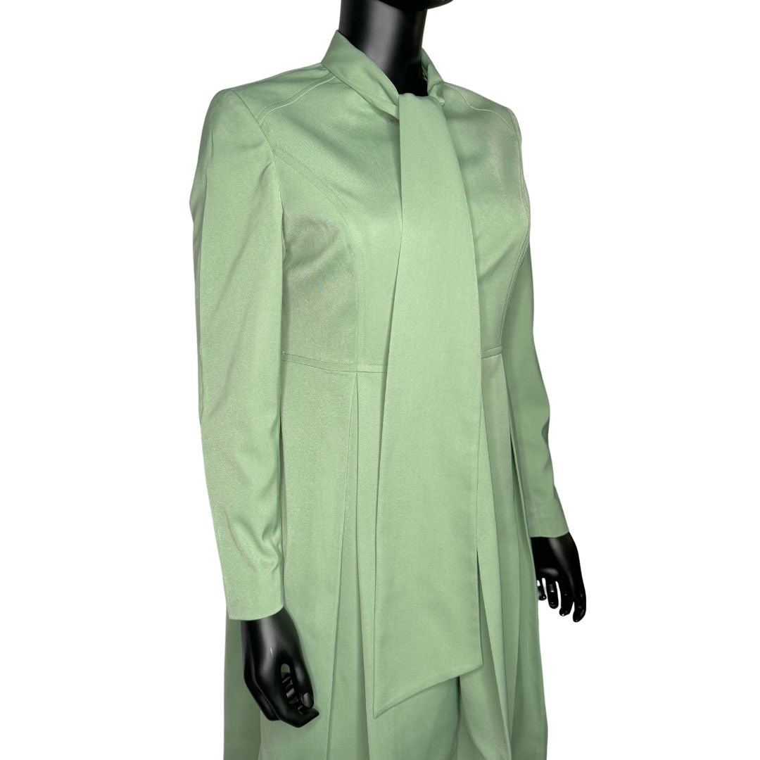 Tilted upper front view of the Sadiyah Bow three-piece sage green garment on a mannequin, designed for Muslim sisters in the Nation of Islam who value women's modest clothing.