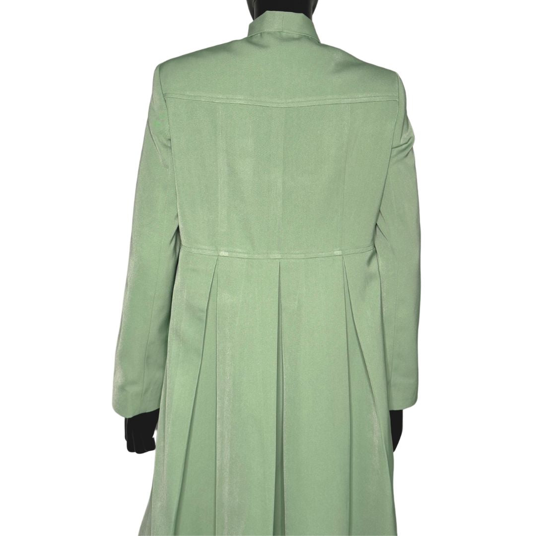 Upper body back view of the Sadiyah Bow three-piece sage green garment on a mannequin, designed for Muslim sisters in the Nation of Islam who value women's modest clothing.