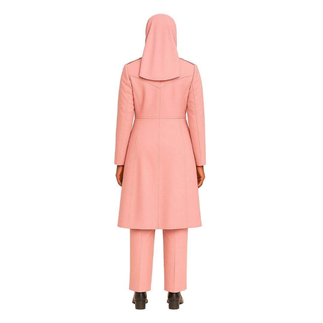 Person wearing a pink coat and pants on a white background