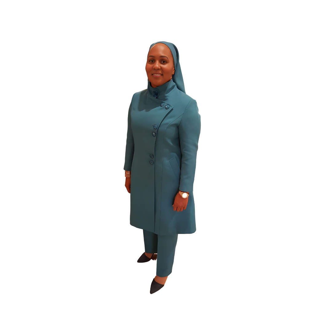 Full-body view of Vicky modeling the Aminah three-piece dark fuchsia garment from a tilted front and side angle, designed for Muslim sisters in the Nation of Islam who value women's modest clothing.